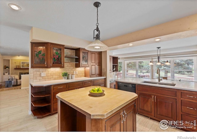 412 Terry Point Dr, Fort Collins, CO 80524 - kitchen with open shelves, a kitchen island, dishwasher, decorative backsplash, and decorative light fixtures