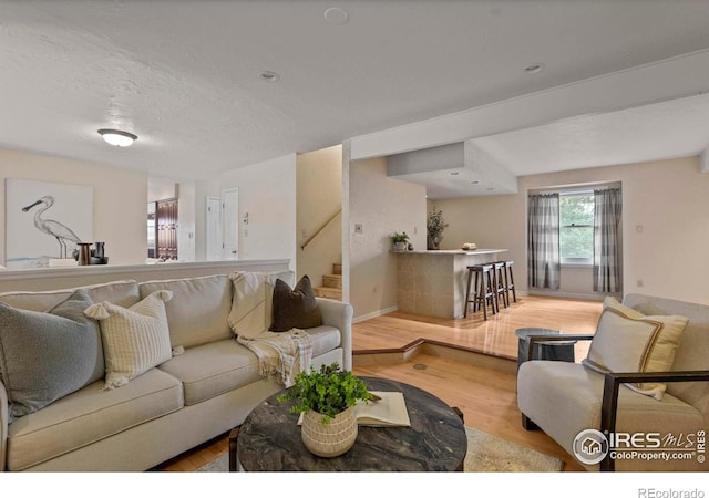 412 Terry Point Dr, Fort Collins, CO 80524 - living room featuring wood finished floors and stairs