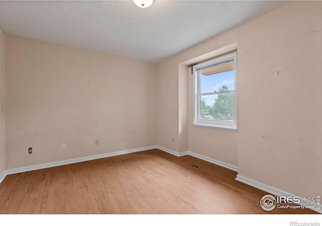 412 Terry Point Dr, Fort Collins, CO 80524 - spare room with wood finished floors and baseboards