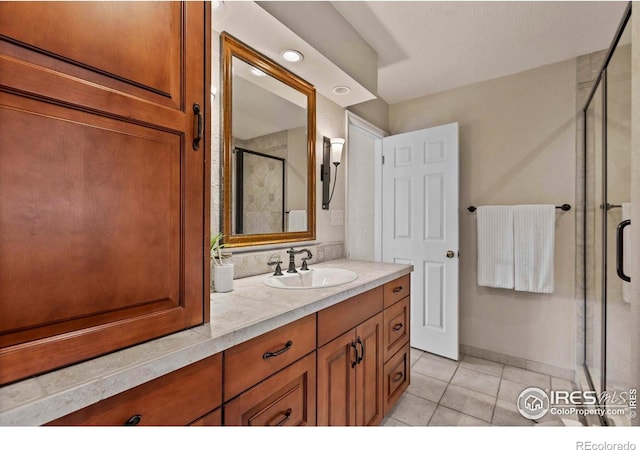 412 Terry Point Dr, Fort Collins, CO 80524 - bathroom with a shower stall, vanity, and tile patterned flooring