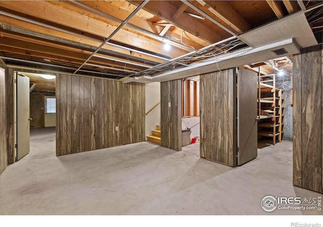 412 Terry Point Dr, Fort Collins, CO 80524 - basement with stairs and wood walls