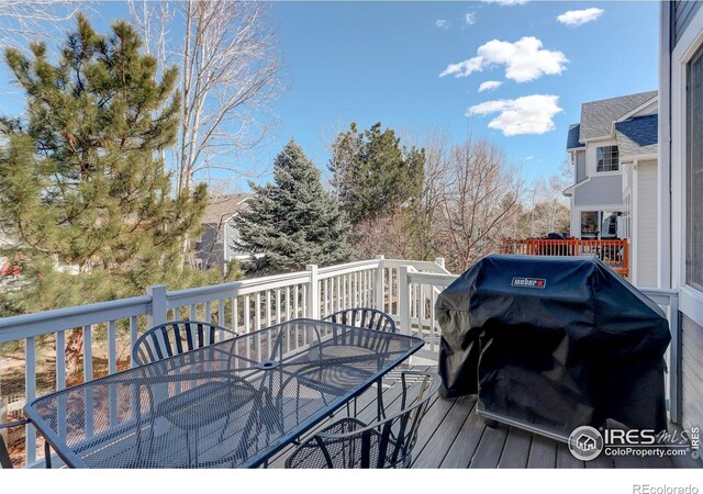 2547 Concord Cir, Lafayette, CO 80026 - wooden terrace with outdoor dining space and area for grilling
