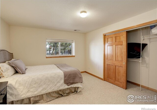 2547 Concord Cir, Lafayette, CO 80026 - carpeted bedroom featuring a closet and baseboards