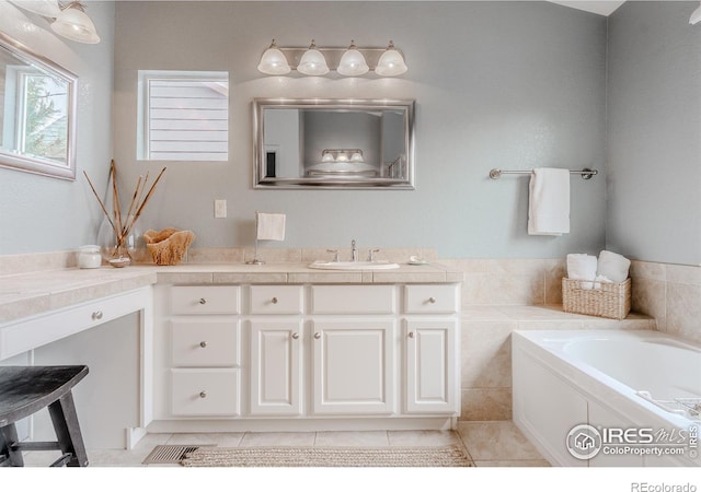 8367 Devinney St, Arvada, CO 80005 - bathroom with vanity, a garden tub, and tile patterned flooring