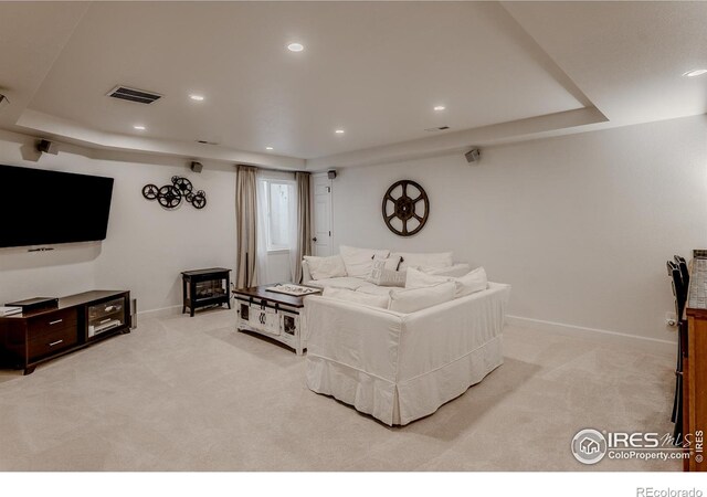 8367 Devinney St, Arvada, CO 80005 - living room featuring light colored carpet, recessed lighting, and a raised ceiling
