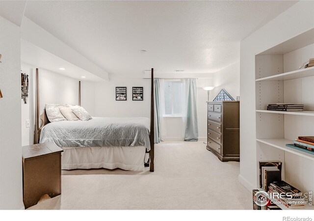 8367 Devinney St, Arvada, CO 80005 - bedroom with light carpet and recessed lighting