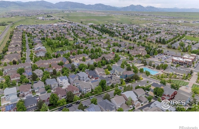 8367 Devinney St, Arvada, CO 80005 - aerial view of property and surrounding area with a mountainous background