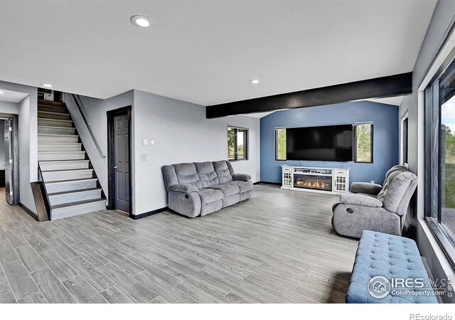1424 Sheep Ridge Rd, Fairplay, CO 80440 - living room featuring stairway, recessed lighting, a glass covered fireplace, and wood finished floors