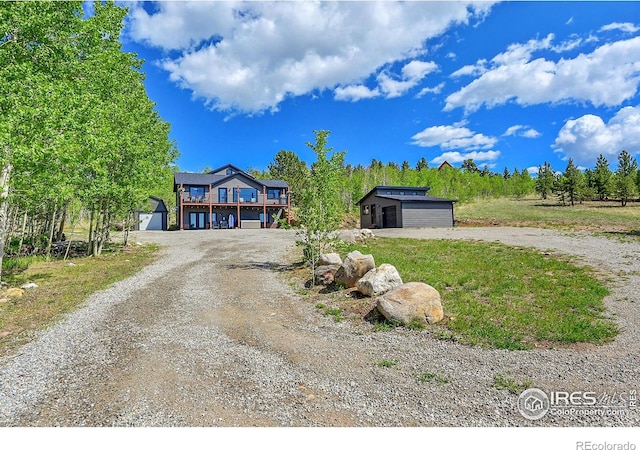 1424 Sheep Ridge Rd, Fairplay, CO 80440 - view of front of property featuring an outbuilding, dirt driveway, and a garage
