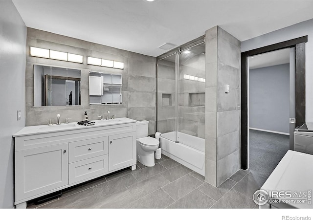 1424 Sheep Ridge Rd, Fairplay, CO 80440 - full bath featuring double vanity, enclosed tub / shower combo, tile walls, and tile patterned floors
