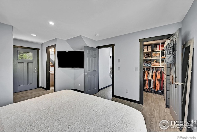 1424 Sheep Ridge Rd, Fairplay, CO 80440 - bedroom featuring wood finished floors, a spacious closet, recessed lighting, and a closet