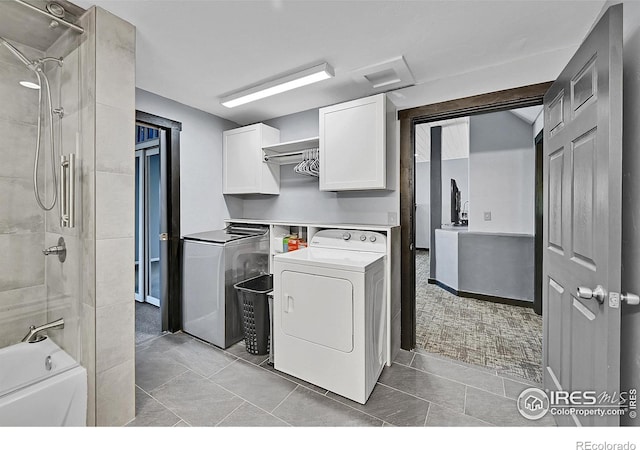 1424 Sheep Ridge Rd, Fairplay, CO 80440 - laundry area with washer and clothes dryer and light tile patterned flooring