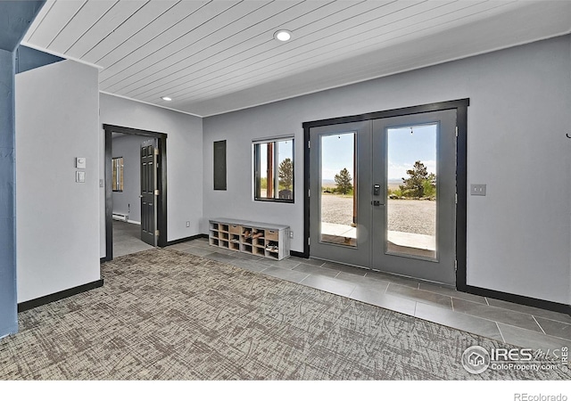1424 Sheep Ridge Rd, Fairplay, CO 80440 - spare room featuring french doors, tile patterned floors, recessed lighting, wooden ceiling, and carpet floors