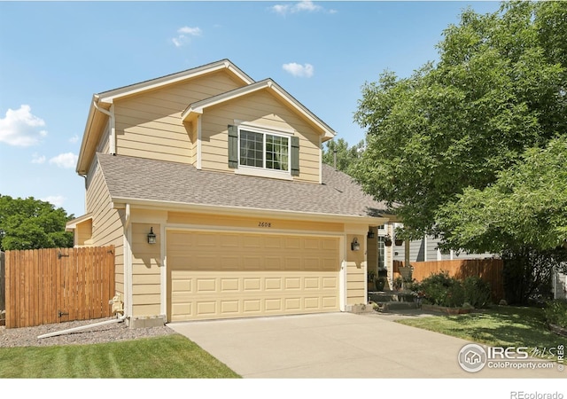 2608 E 132nd Ave, Thornton, CO 80241 - traditional-style house with a shingled roof, driveway, and an attached garage