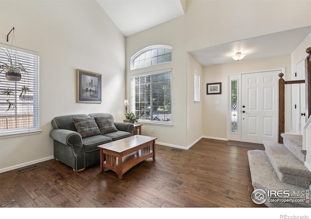 2608 E 132nd Ave, Thornton, CO 80241 - living room featuring stairs, hardwood / wood-style flooring, and high vaulted ceiling