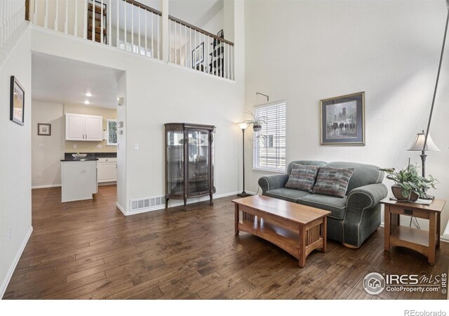 2608 E 132nd Ave, Thornton, CO 80241 - living area with dark wood finished floors and a high ceiling