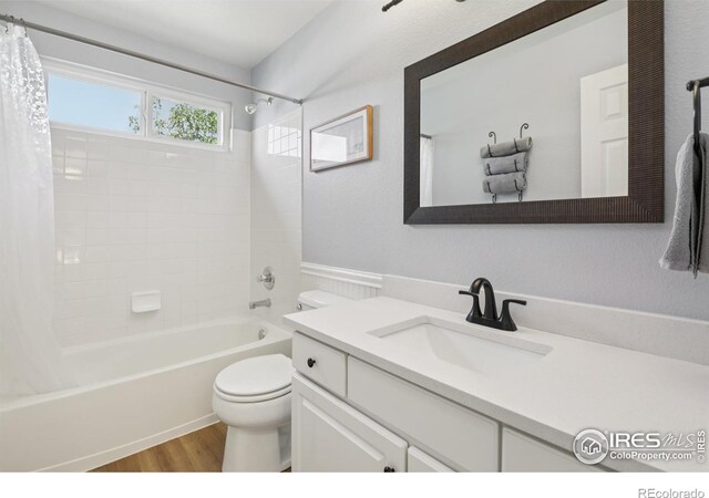 2608 E 132nd Ave, Thornton, CO 80241 - bathroom featuring shower / bath combination with curtain, wood finished floors, and vanity