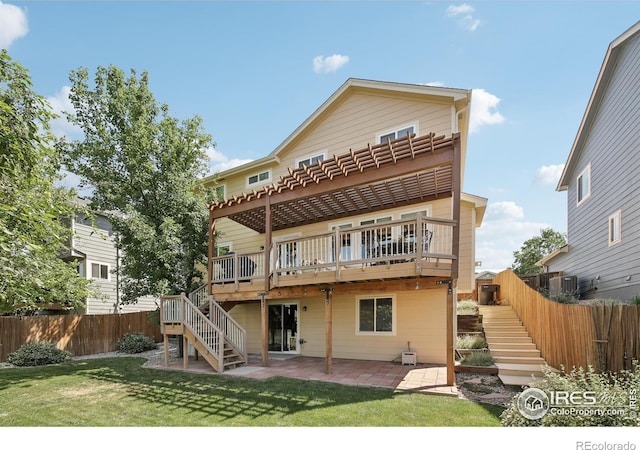 2608 E 132nd Ave, Thornton, CO 80241 - rear view of house with stairs, a patio area, and a deck