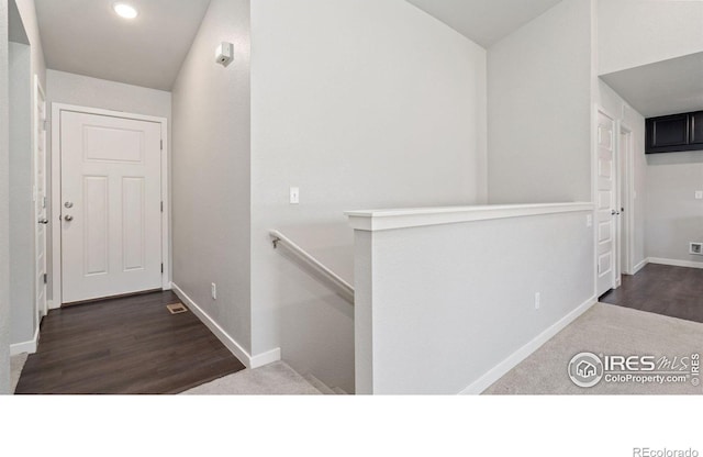 627 Overland Trl, Ault, CO 80610 - corridor with an upstairs landing, recessed lighting, carpet, and wood finished floors