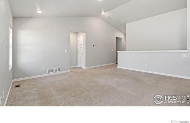 627 Overland Trl, Ault, CO 80610 - empty room featuring vaulted ceiling and carpet floors