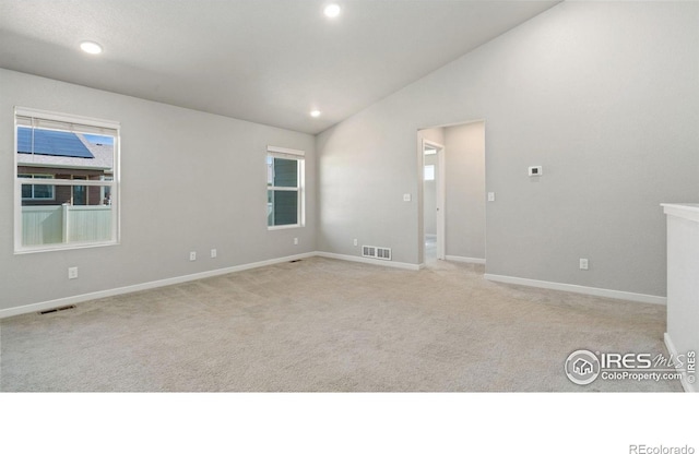 627 Overland Trl, Ault, CO 80610 - spare room with vaulted ceiling, light colored carpet, and recessed lighting