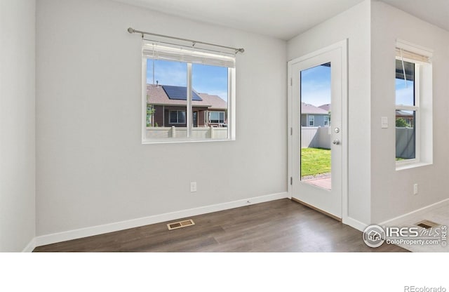 627 Overland Trl, Ault, CO 80610 - doorway featuring plenty of natural light and wood finished floors
