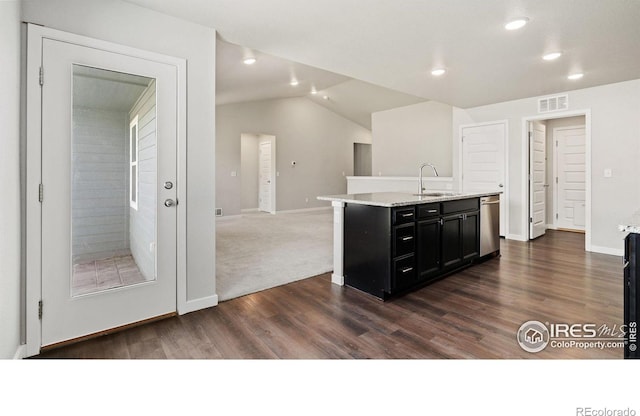 627 Overland Trl, Ault, CO 80610 - kitchen with dark cabinetry, dark wood-style flooring, an island with sink, dishwasher, and recessed lighting