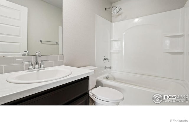 627 Overland Trl, Ault, CO 80610 - full bathroom featuring tasteful backsplash, vanity, and  shower combination