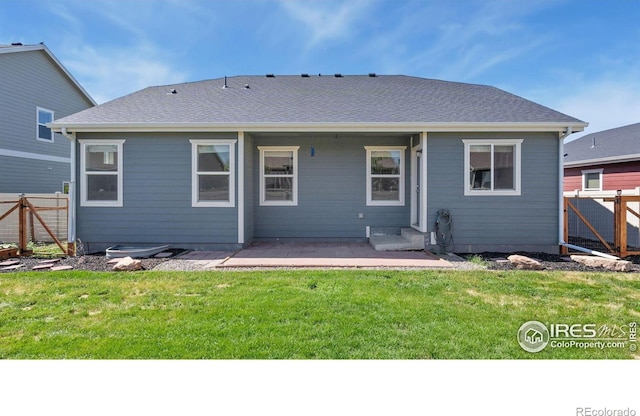 627 Overland Trl, Ault, CO 80610 - rear view of house featuring a fenced backyard and a patio area