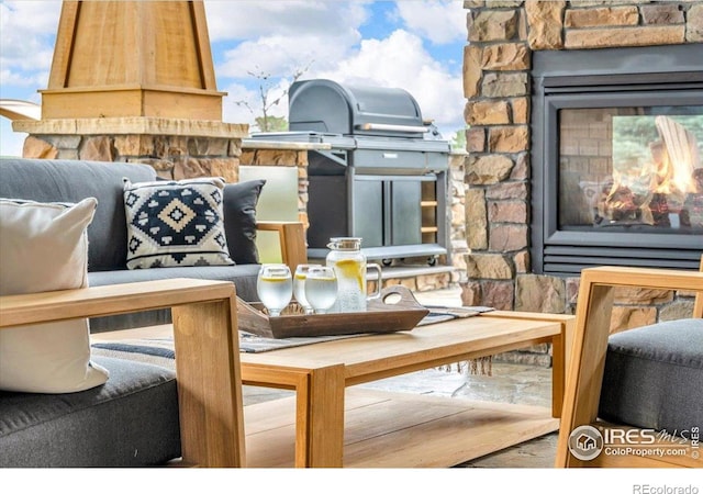 37021 Kingfisher Ct, Severance, CO 80550 - view of patio / terrace with a multi sided fireplace and a grill