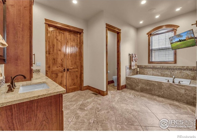 37021 Kingfisher Ct, Severance, CO 80550 - bathroom with a garden tub, vanity, and recessed lighting