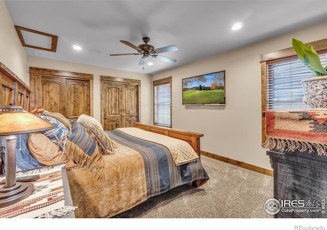 37021 Kingfisher Ct, Severance, CO 80550 - carpeted bedroom featuring multiple windows, recessed lighting, a ceiling fan, and multiple closets