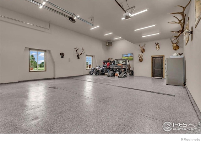 37021 Kingfisher Ct, Severance, CO 80550 - garage featuring freestanding refrigerator