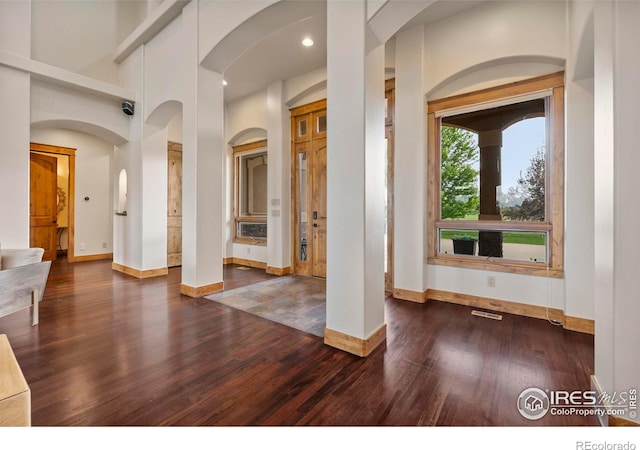 863 Riparian Way, Fort Collins, CO 80524 - foyer with dark wood-type flooring, recessed lighting, and arched walkways