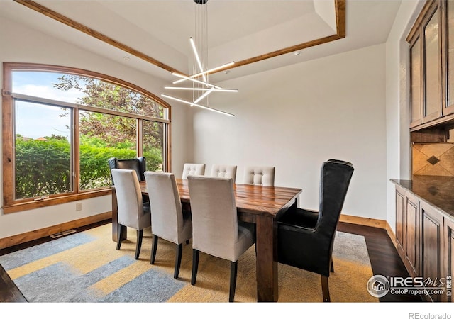 863 Riparian Way, Fort Collins, CO 80524 - dining area featuring a chandelier and dark wood-style floors