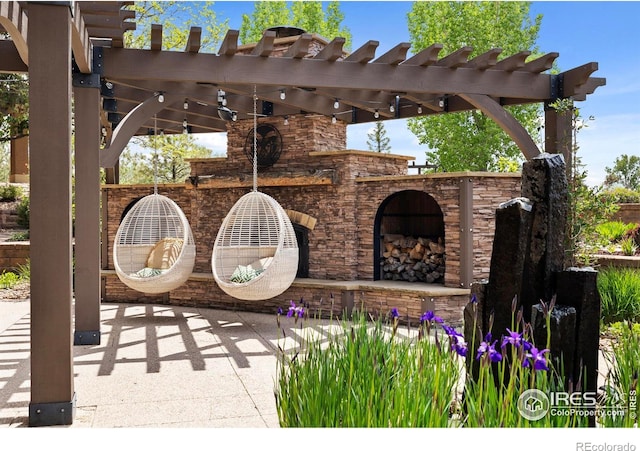 863 Riparian Way, Fort Collins, CO 80524 - view of patio / terrace featuring an outdoor stone fireplace and a pergola
