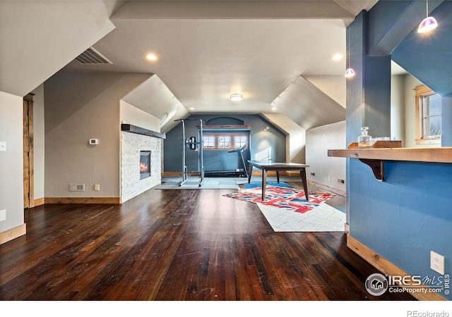 863 Riparian Way, Fort Collins, CO 80524 - bonus room with hardwood / wood-style flooring, a stone fireplace, and lofted ceiling
