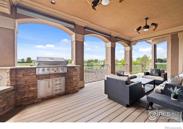 863 Riparian Way, Fort Collins, CO 80524 - wooden deck featuring an outdoor hangout area, a ceiling fan, and an outdoor kitchen