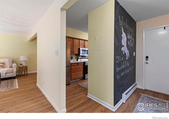 705 E Drake Rd Unit 40, Fort Collins, CO 80525 - entryway featuring a baseboard heating unit and light wood-type flooring