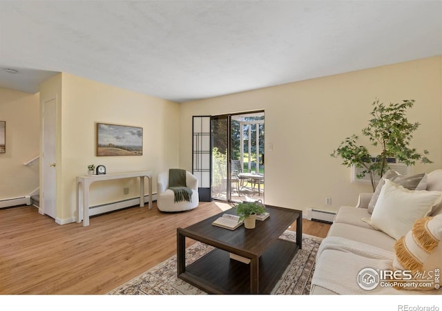 705 E Drake Rd Unit 40, Fort Collins, CO 80525 - living room with a baseboard radiator and light wood-style flooring