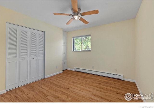 705 E Drake Rd Unit 40, Fort Collins, CO 80525 - unfurnished bedroom with baseboard heating, light wood-type flooring, a closet, and a ceiling fan