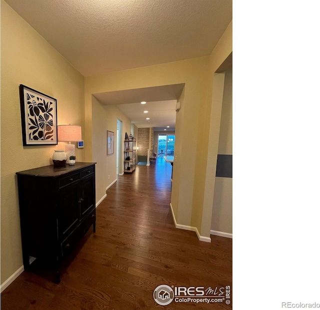 306 Baja Dr, Windsor, CO 80550 - hall featuring dark wood finished floors and baseboards