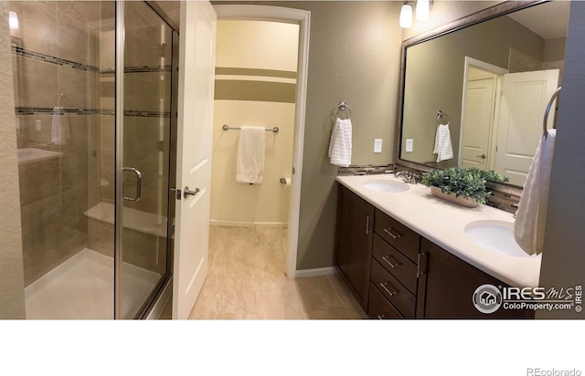 306 Baja Dr, Windsor, CO 80550 - full bath featuring double vanity and a shower stall