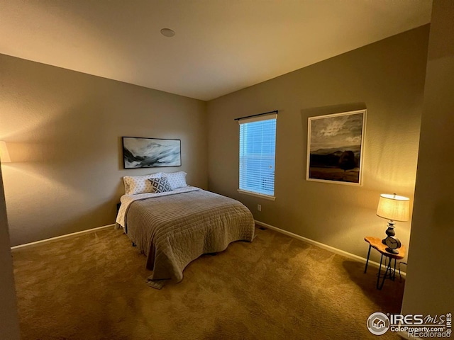 306 Baja Dr, Windsor, CO 80550 - bedroom featuring carpet flooring and vaulted ceiling