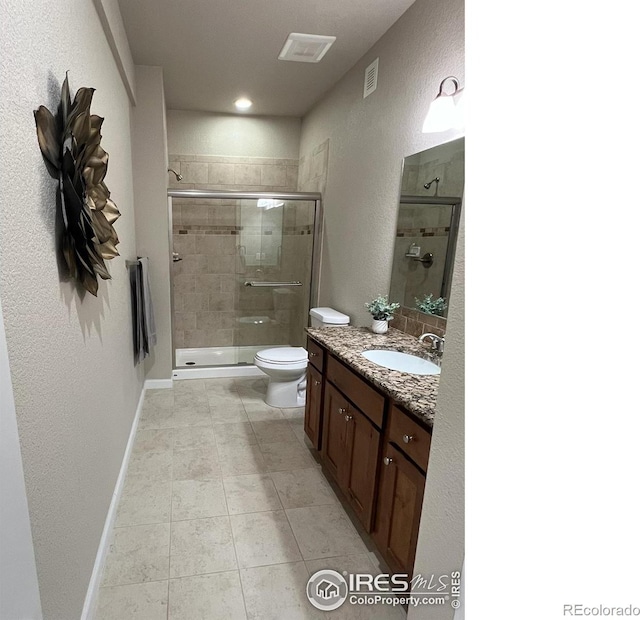 306 Baja Dr, Windsor, CO 80550 - full bath featuring vanity, a stall shower, tile patterned flooring, and a textured wall