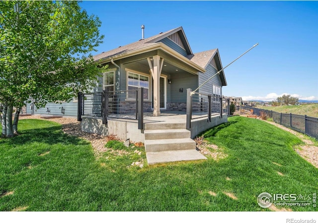 306 Baja Dr, Windsor, CO 80550 - view of front of property with stone siding and covered porch