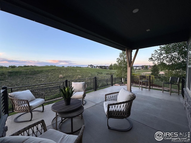 306 Baja Dr, Windsor, CO 80550 - patio terrace at dusk featuring a balcony
