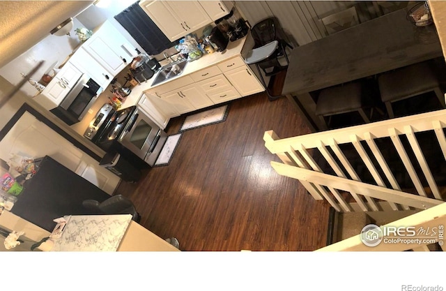3200 Claremont Ave, Evans, CO 80620 - kitchen with wood finished floors