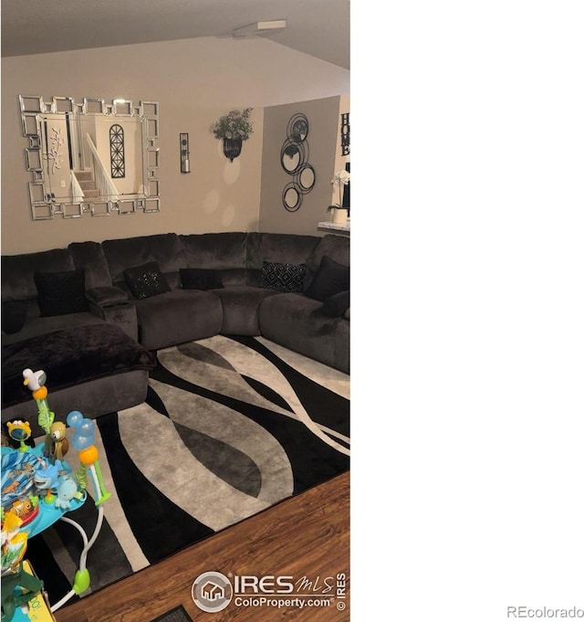 3200 Claremont Ave, Evans, CO 80620 - living room with lofted ceiling and wood finished floors