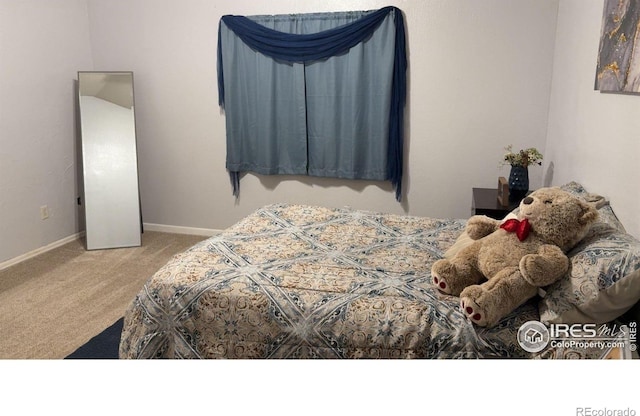 3200 Claremont Ave, Evans, CO 80620 - carpeted bedroom featuring baseboards